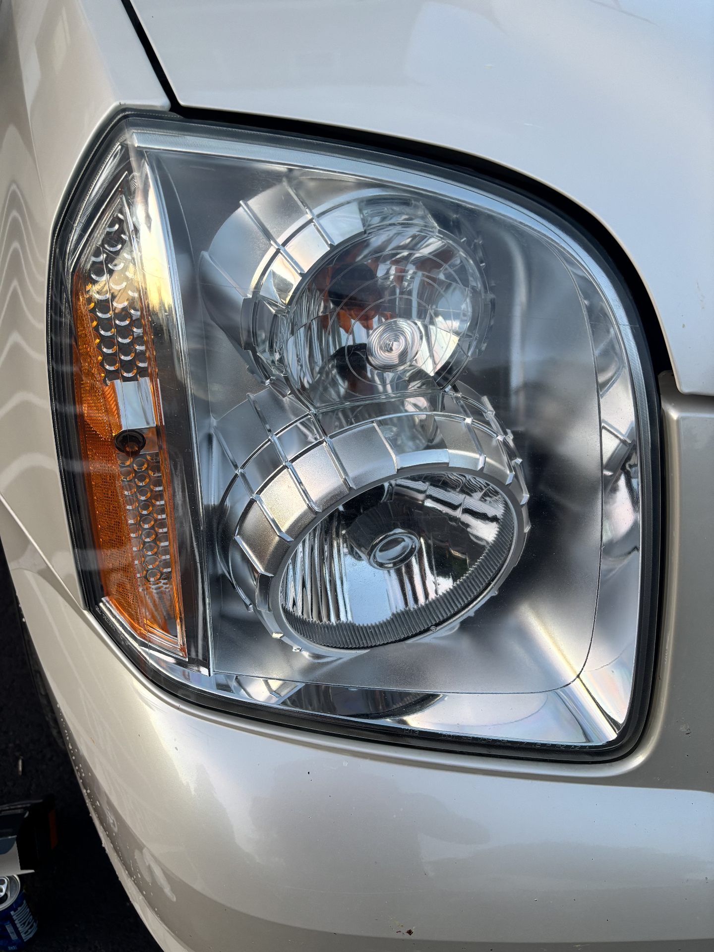 Crystal-clear GMC headlight after restoration service